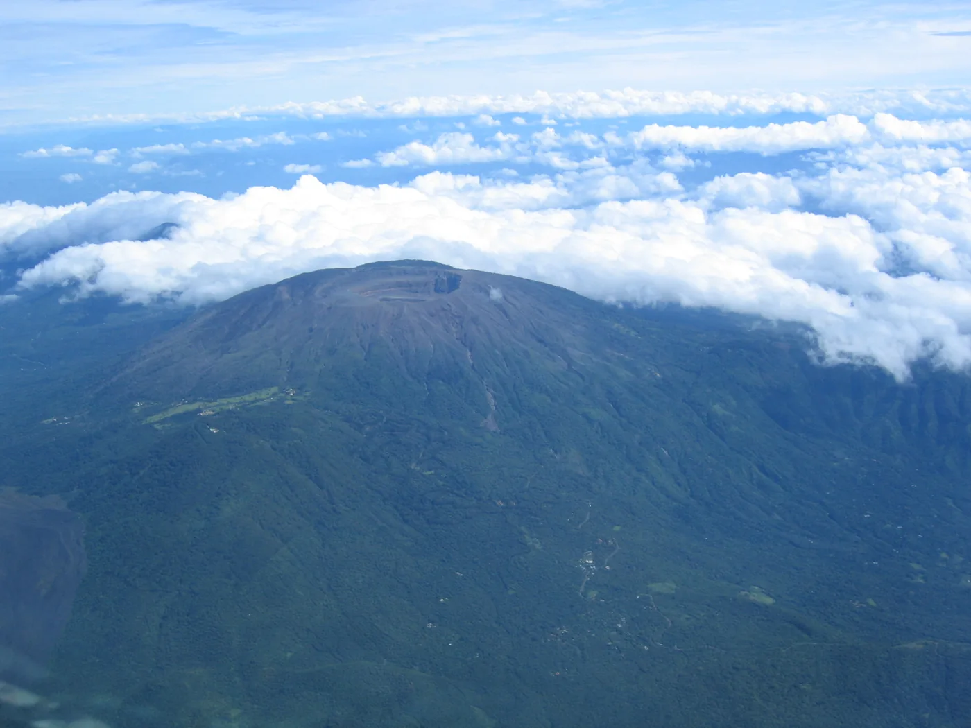 The Santa Ana volcano rising above a layer of clouds in El Salvador